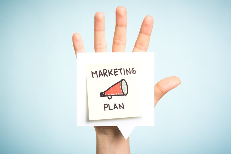 Small business marketing plan in hand.