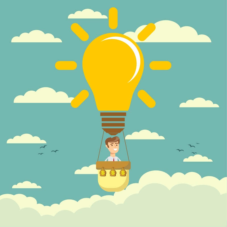 Man in a hot air balloon in the shape of a lightbulb